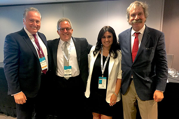 Warren Kirshenbaum and Melina Ambrosino of The Cherrytree Group with other guest speakers during a past Marcum Microcap Conference.